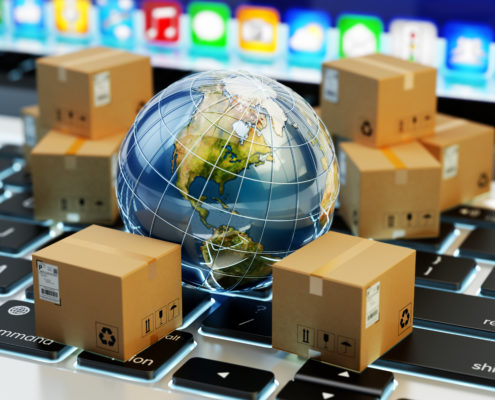 Internet shopping, online purchases, e-commerce, international package delivery concept, global transportation business, stack of cardboard boxes and Earth globe on computer keyboard